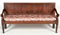 Lot 1304 - An early 19th Century oak settle, the panel...