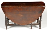 Lot 1306 - An 18th Century and later drop leaf dining...