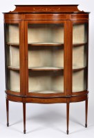 Lot 1318 - An Edwardian inlaid mahogany serpentine front...