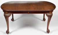 Lot 1320 - A mahogany extending dining table, the top...