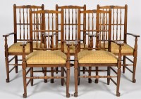 Lot 1333 - A set of eight oak spindle back open arm North...