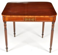 Lot 1335 - An early 19th Century inlaid mahogany turnover...