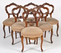 Lot 1356 - A set of six Victorian carved walnut decorated...