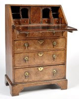 Lot 1357 - A George I style walnut bureau, the top and...