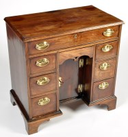 Lot 1359 - A George III mahogany kneehole desk, fitted...