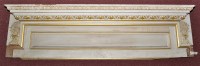 Lot 1365 - A white and gold painted carved pine door...