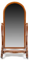 Lot 1369 - A Victorian mahogany cheval mirror, the arched...