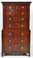 Lot 1376 - An 18th Century oak chest-on-chest, the flared...