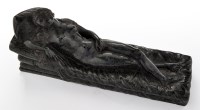 Lot 360 - A carved verde antico marble reclining female...