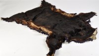 Lot 421 - A taxidermy black bear skin rug, circa 1900,...