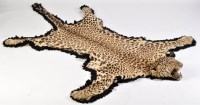 Lot 422 - A taxidermy mounted leopard-skin rug, circa...
