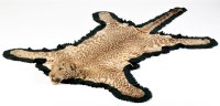 Lot 424 - A taxidermy mounted cheetah skin rug, by Van...