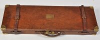 Lot 452 - A vintage tan leather on wood case for a pair...