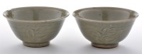 Lot 485 - Near pair of Yaozhou celadon type stoneware...