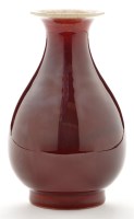 Lot 502 - Red glaze pear shaped vase, with narrow neck...