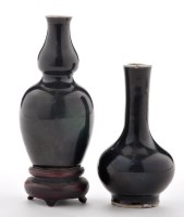 Lot 509 - Black glaze bottle shape cabinet vase, with...