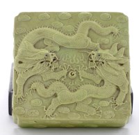 Lot 513 - Caved lime-green glaze box and cover, with...