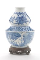 Lot 522 - Blue and white double gourd shaped vase, the...