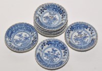 Lot 527 - Eight blue and white saucer dishes, the ribbed...