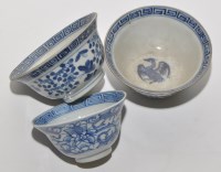 Lot 530 - Pair of blue and white bowls, the interiors...