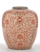 Lot 545 - Iron red jar, with scrolls and floral pendants,...