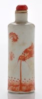 Lot 558 - Iron red 'writhing dragon' cylindrical snuff...