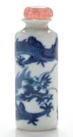 Lot 561 - Blue and white 'dragon' cylindrical snuff...