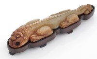 Lot 589 - Archaistic jade mythological beast of lizard...