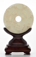 Lot 598 - Archiastic celadon jade 'chilong' disc, bi,...