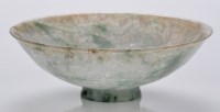 Lot 604 - Small mottled green jadeite shallow bowl, with...