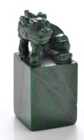 Lot 611 - Variegated green hardstone 'beast' seal, the...