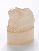 Lot 612 - White jade 'hare' seal, in a recumbent pose...