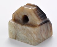 Lot 614 - Variegated jade seal of archaistic form, the...