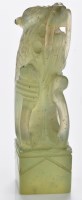 Lot 616 - Olive jade 'beast' seal, the bearded beast...