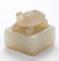 Lot 617 - Pale celadon jade 'tortoise' seal, the...