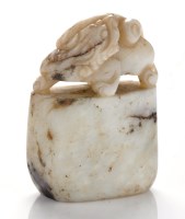 Lot 639 - Veined white agate 'beast' seal, with its head...