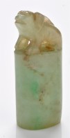 Lot 640 - Small jadeite 'beast' seal, of dog form, on...