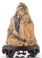 Lot 654 - Carved ivory figure of a seated scholar, with...