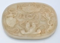 Lot 732 - Chinese celadon 'jade' oval plaque, with four...