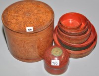 Lot 750 - Set of red lacquer stacking boxes and...