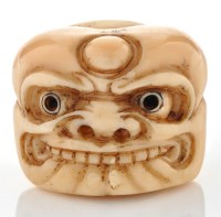 Lot 771 - Japanese carved ivory netsuke of a tanuki...