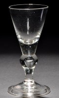 Lot 795 - A baluster wine glass, the conical bowl with a...