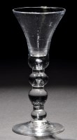 Lot 797 - A baluster wine glass, the waisted bell bowl...