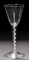 Lot 810 - A tall round funnel bowl wine glass, raised on...