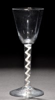 Lot 811 - A tall round funnel bowl wine glass, raised on...