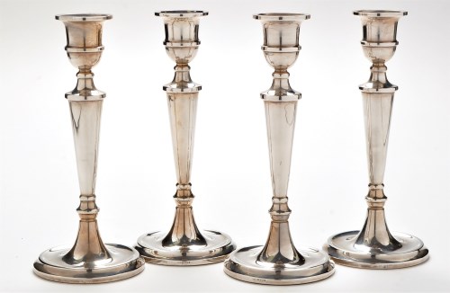 Lot 1052 - A set of four Elizabeth II candlesticks, by...