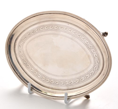 Lot 1091 - A George III teapot stand, by Henry Nutting,...