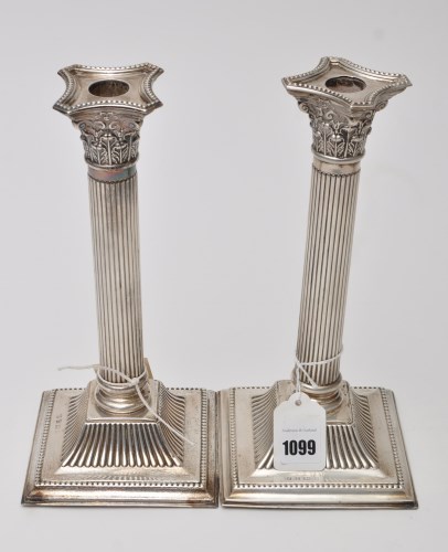 Lot 1099 - A pair of George IV candlesticks, by J....