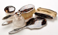 Lot 1140 - A George V matched silver and tortoiseshell...