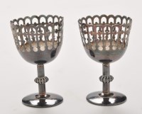 Lot 1174 - A pair of Chinese silver egg cups, with...